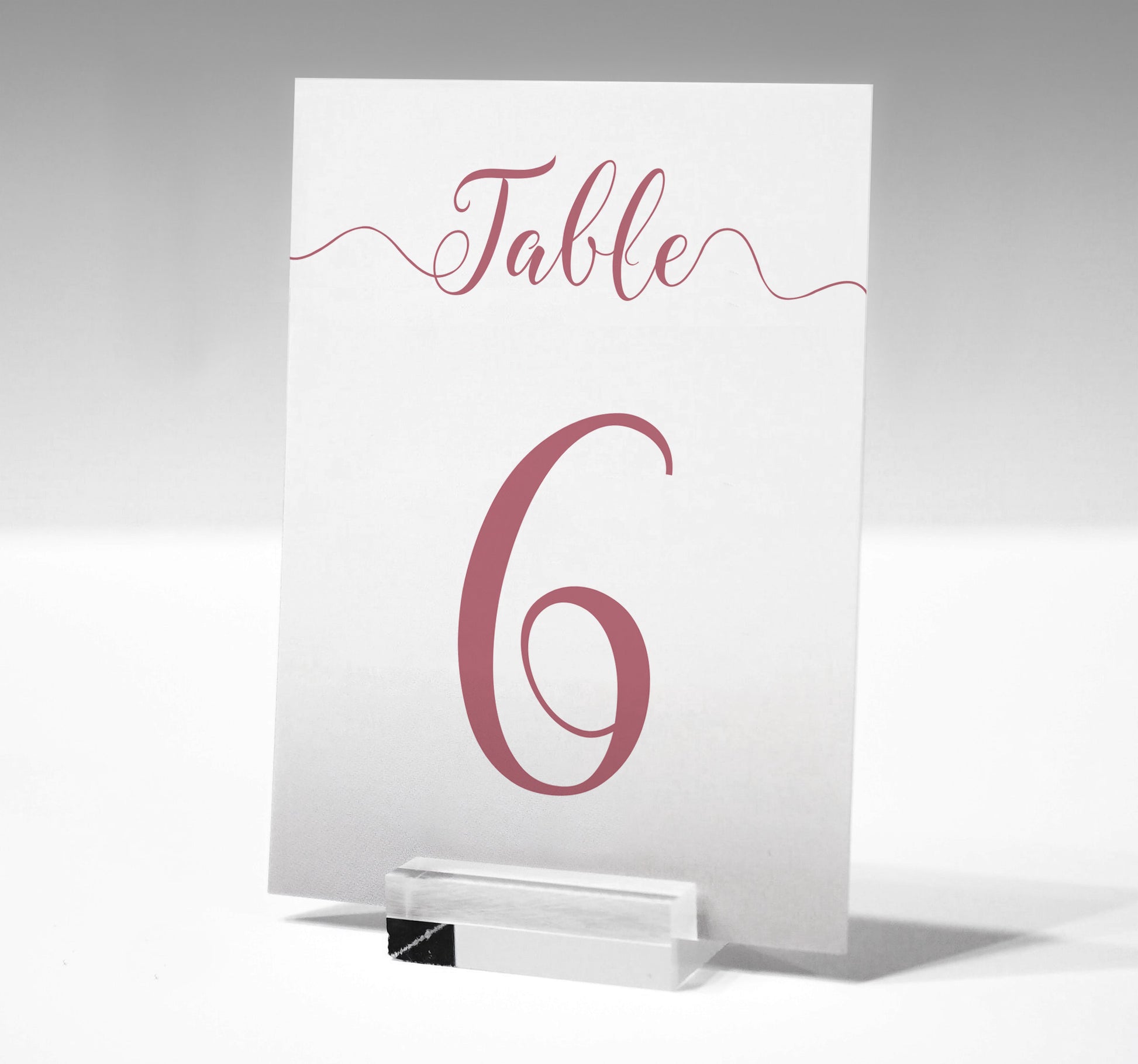 7x5 dusty pink table number printed on card in a glass stand