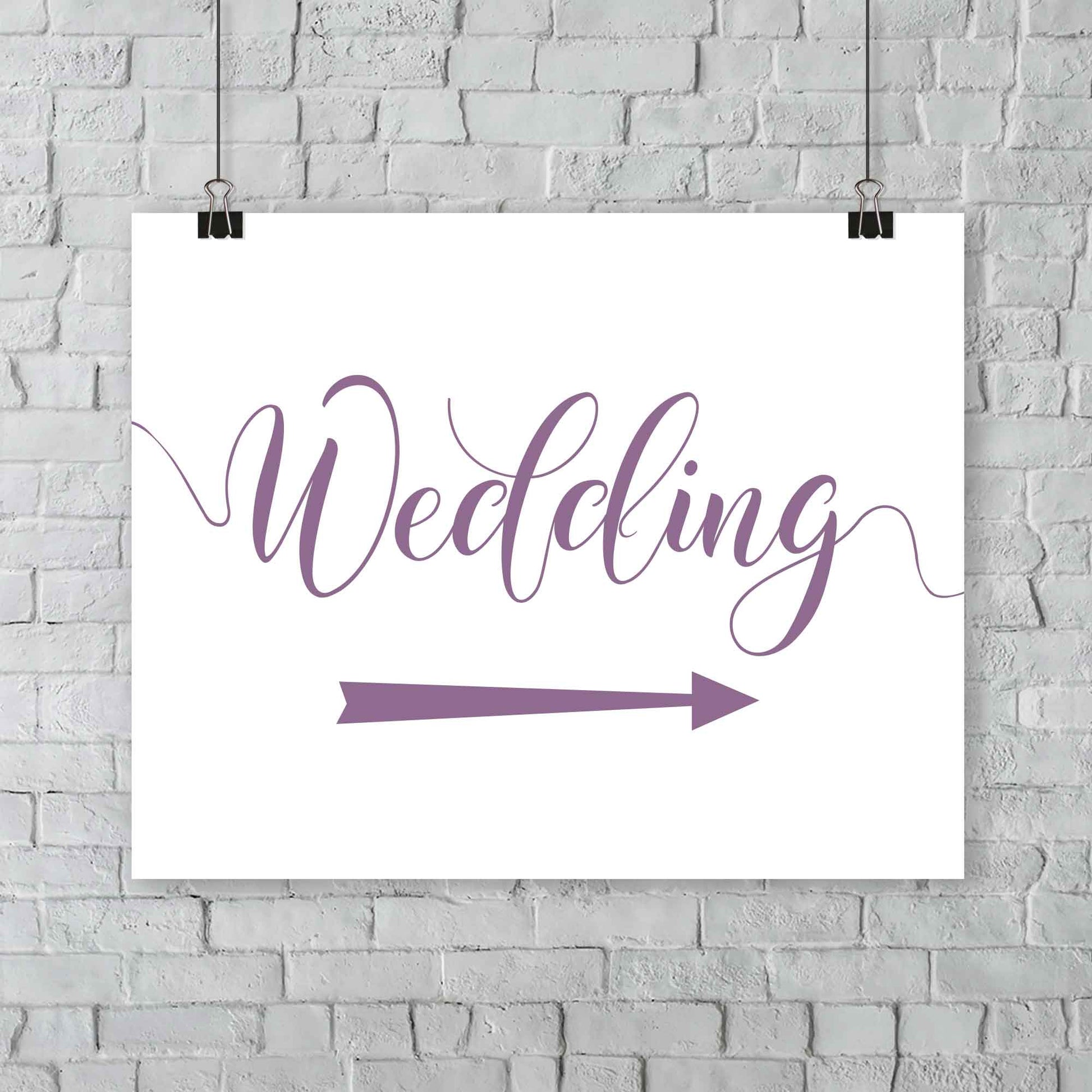 amethyst purple wedding arrow sign print hanging from a wall