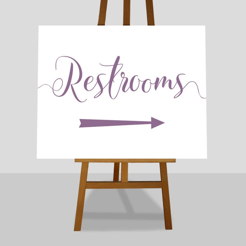 amethyst purple wedding restrooms arrow sign on an easel