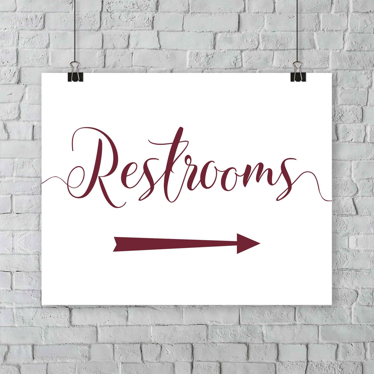 auburn wedding restrooms arrow signage hanging from a wall