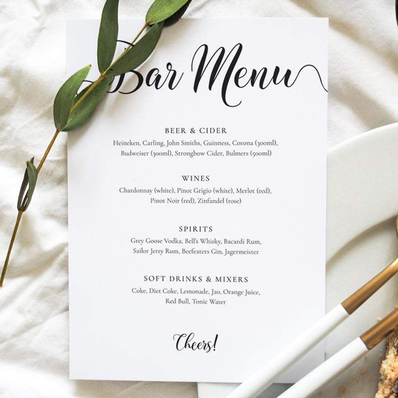 black and white bar menu card on a wedding table
