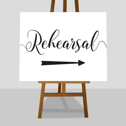 large wedding rehearsal sign with directional arrow pointing right