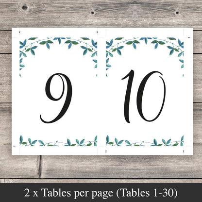 2 table numbers on a sheet ready to download and print on a rustic wood background