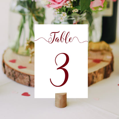 burgundy table number on a wedding table