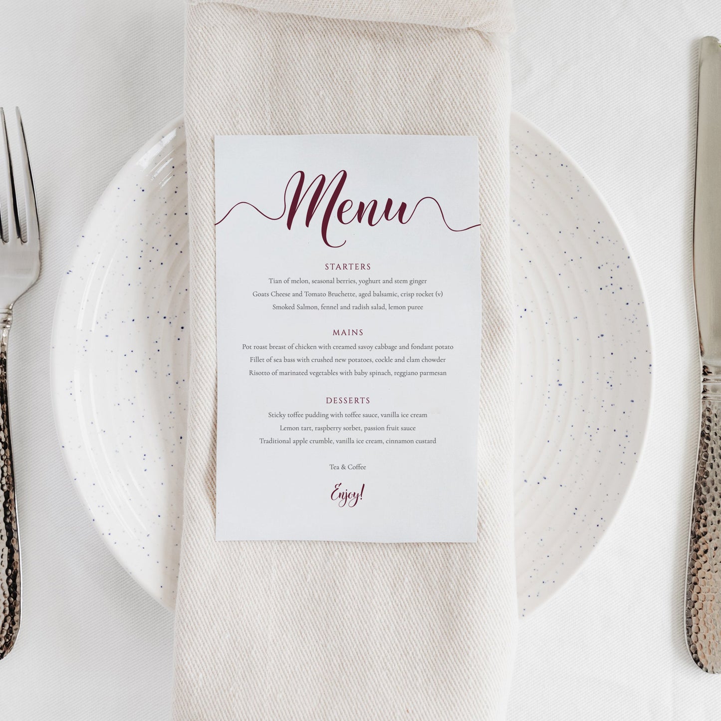 deep red menu card on plate at a wedding