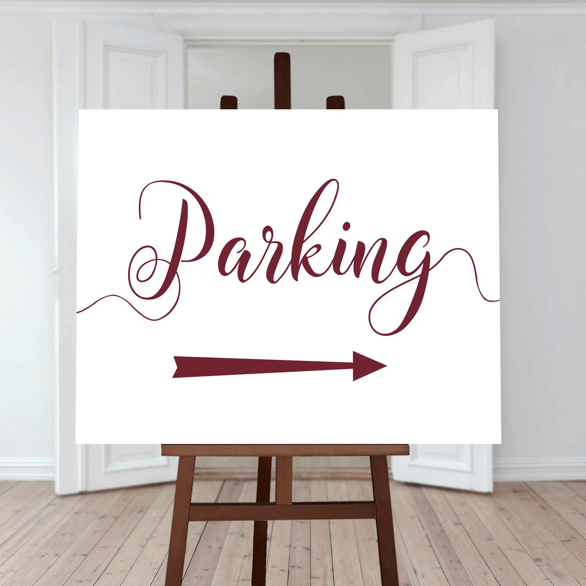 deep red wedding car park directions sign with an arrow pointing right