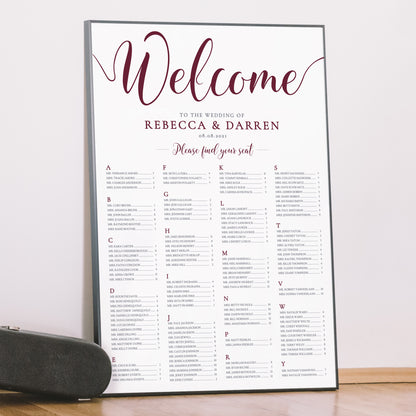 deep red wedding seating chart in a frame