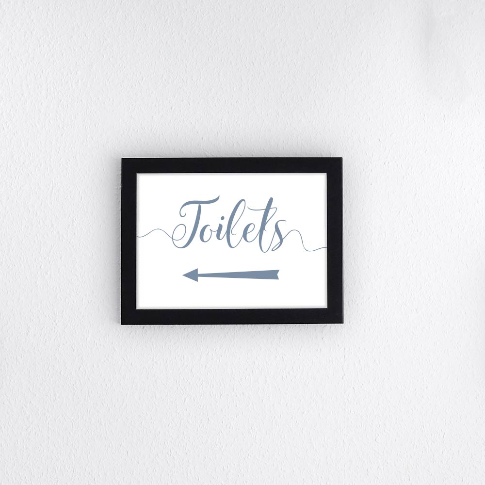 dusty blue directional toilets sign with left arrow printed and framed