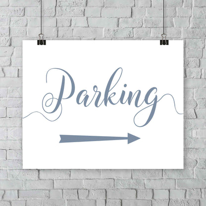 dusty blue parking lot arrow sign hanging from a wall