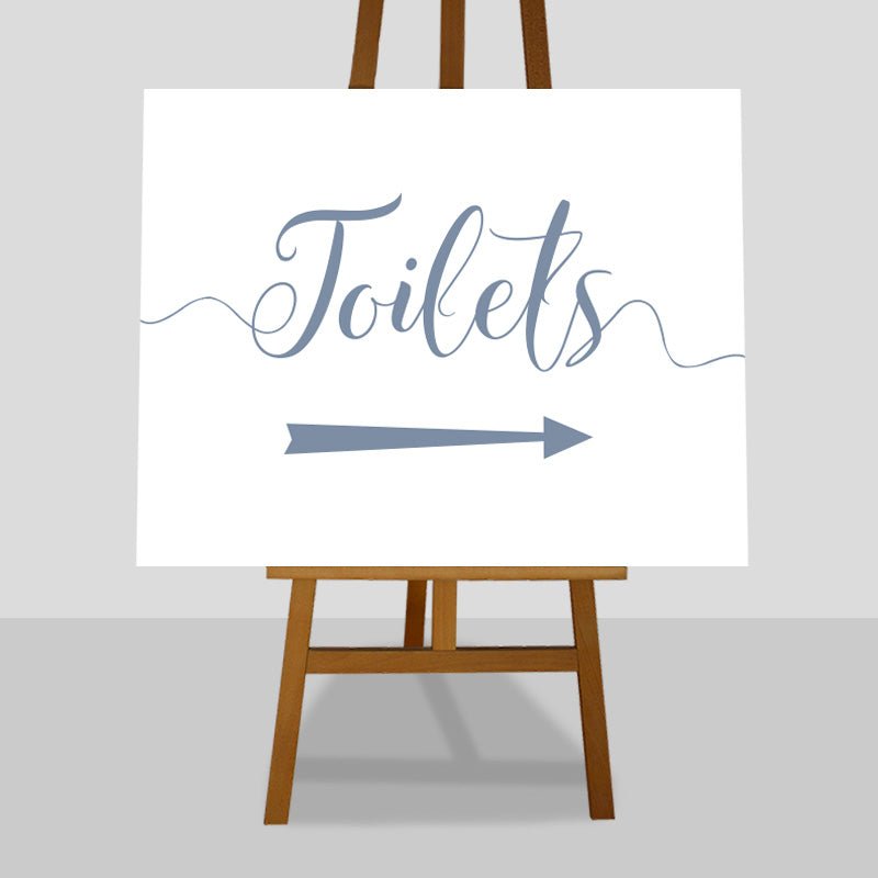 dusty blue wedding toilets arrow sign on an easel