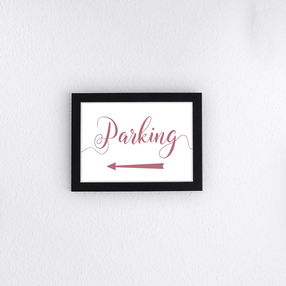 dusty pink directional parking sign with arrow pointing left