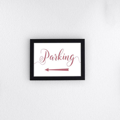 dusty pink directional parking sign with arrow pointing left