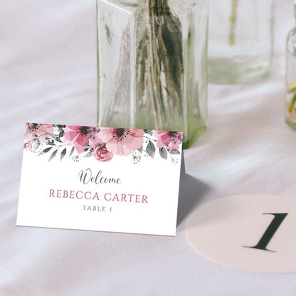 floral folded tent card and table number on a wedding table