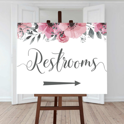 restrooms directions sign right arrow and floral border