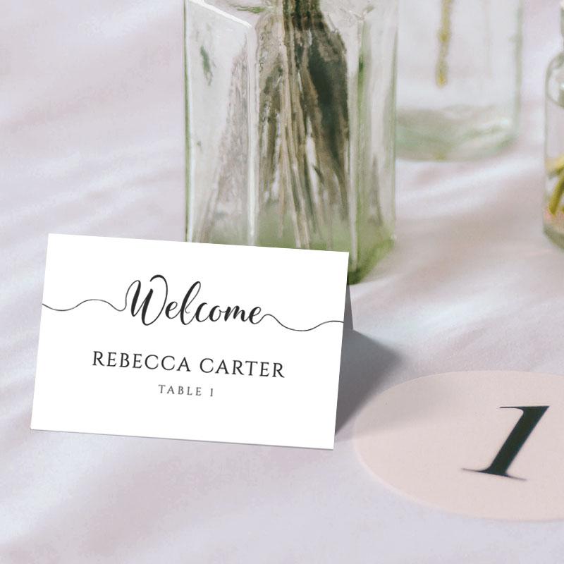 Printable name card folded into a tent card with a wedding table number
