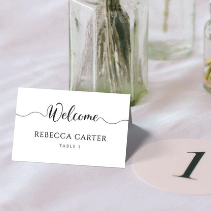 Printable name card folded into a tent card with a wedding table number