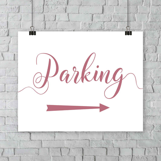 fuchsia pink parking lot arrow sign hanging from a wall