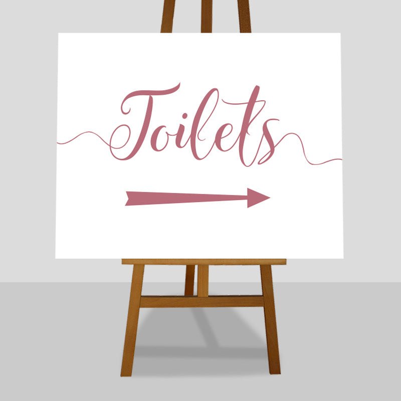 fuchsia pink wedding toilets arrow sign on an easel