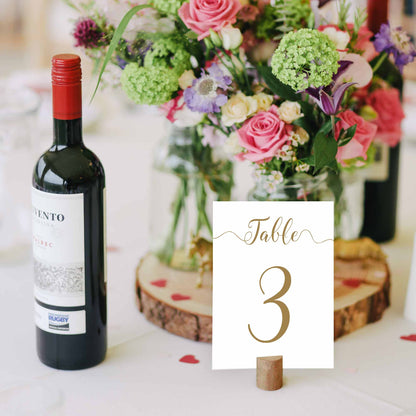 5x7 printable gold table number next to bottle of wine for scale