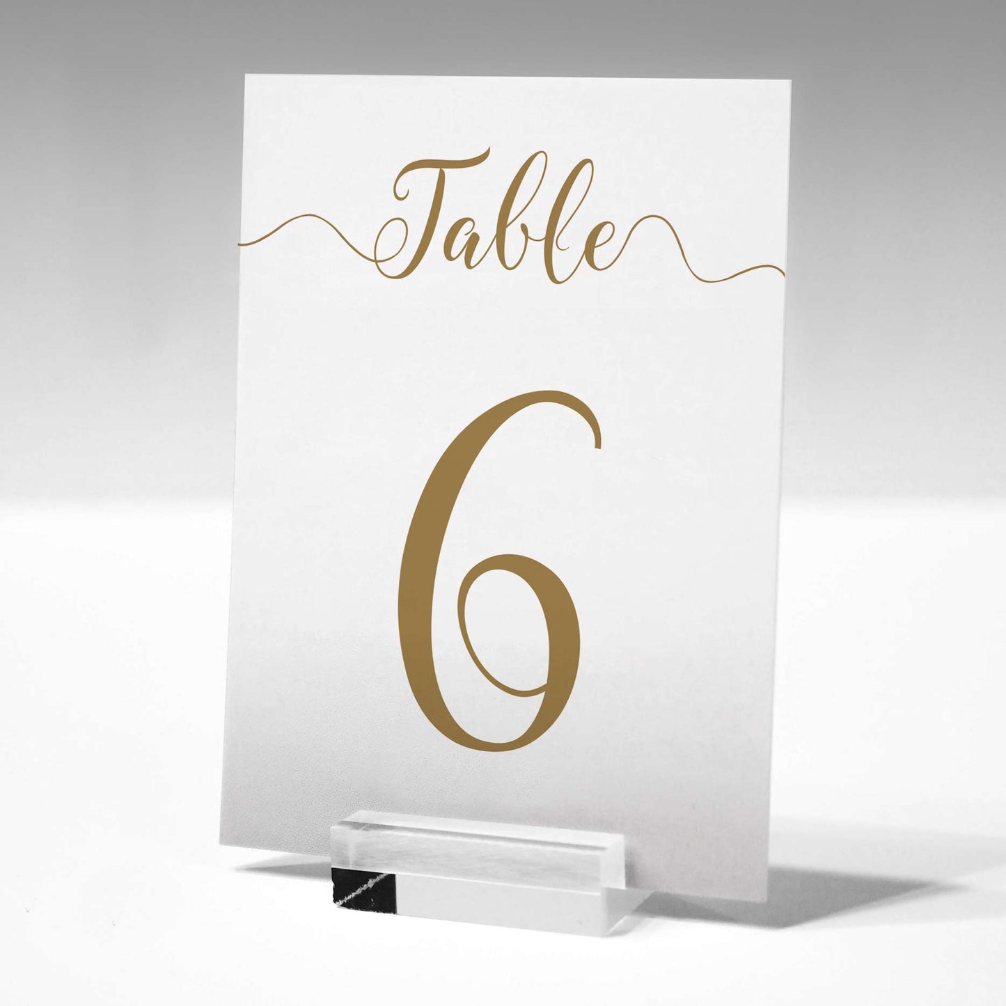 5"x7" gold table number printed on card in a glass stand
