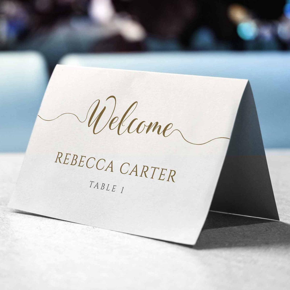 gold personalised name card on wedding table