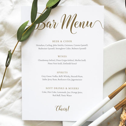 gold drinks menu card on a wedding table