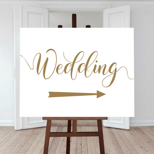 gold wedding directions sign with right arrow