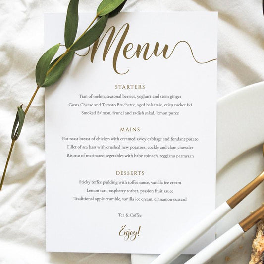 Gold menu card on a wedding table setting