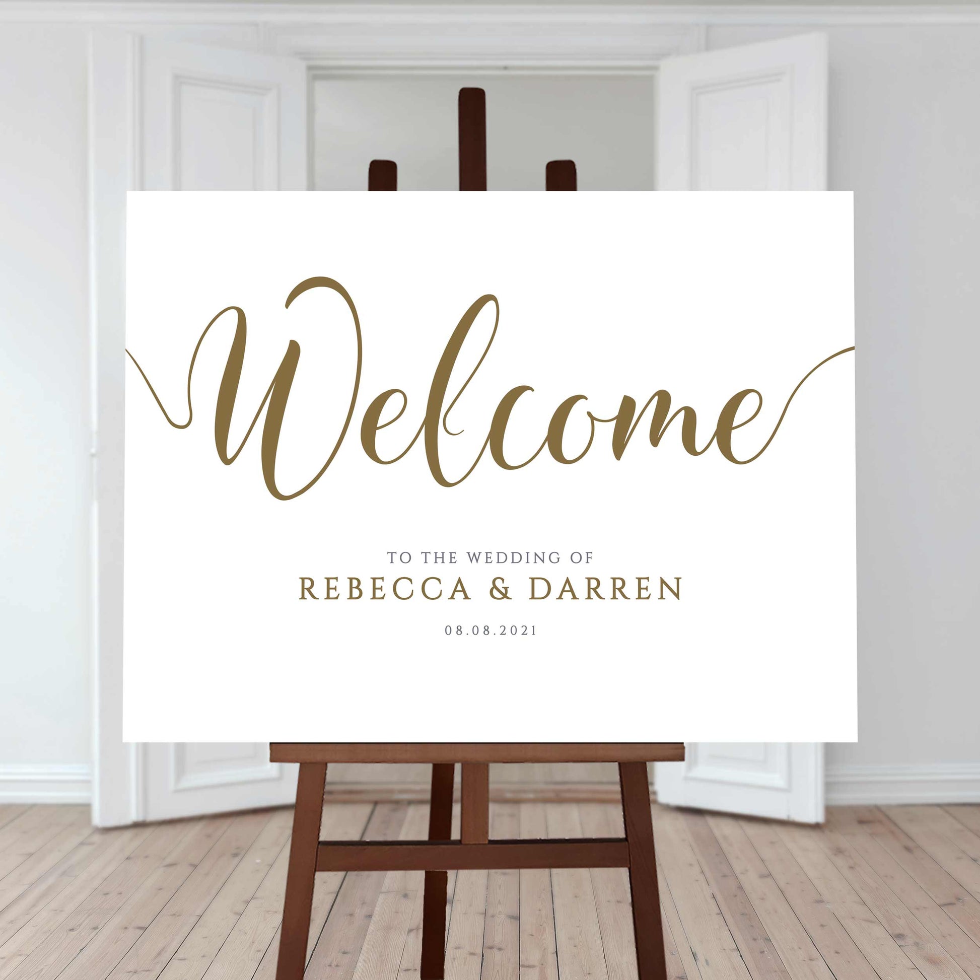 Gold wedding welcome sign printed on an easel