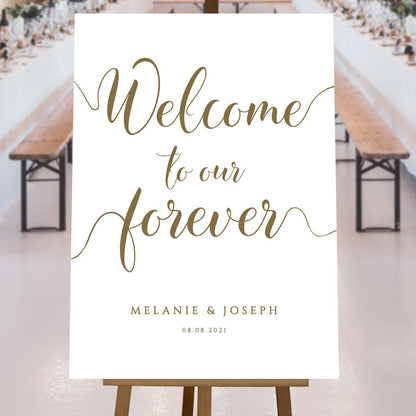 gold welcome to our forever sign at a rustic wedding