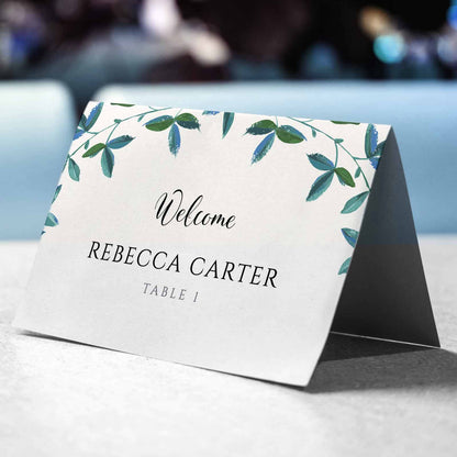 3.75"x5" tent card with green foliage border on a wedding table