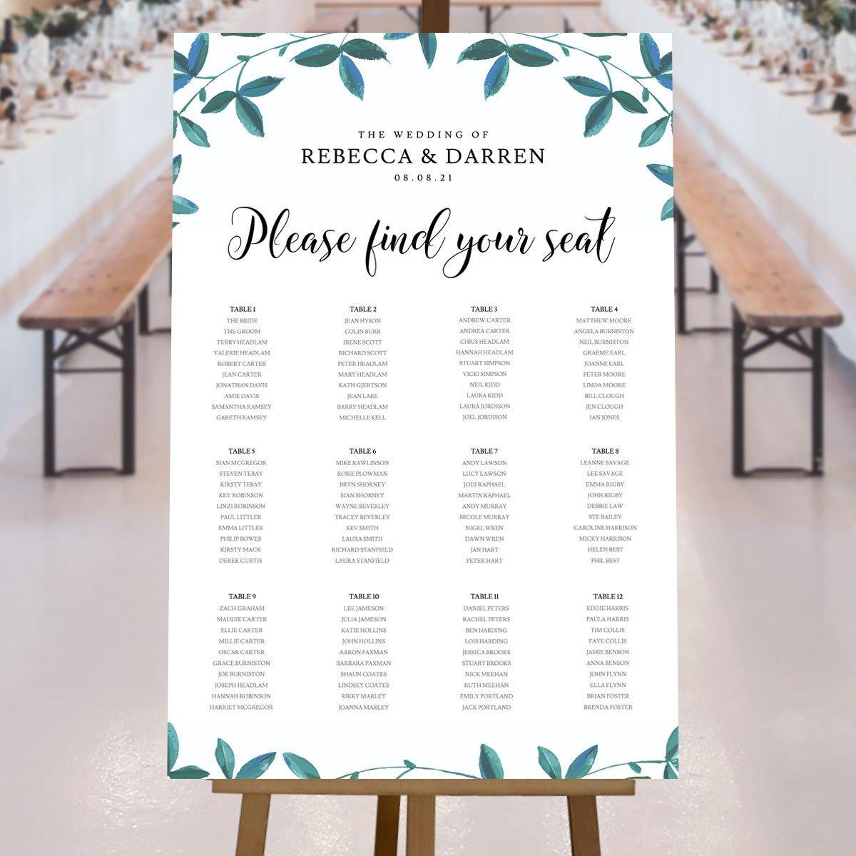 large seating plan with greenery border at rustic wedding reception