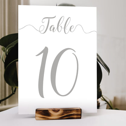 grey silver table number print in a wooden stand at a wedding