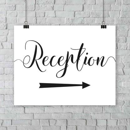 black and white reception sign at an outdoor wedding