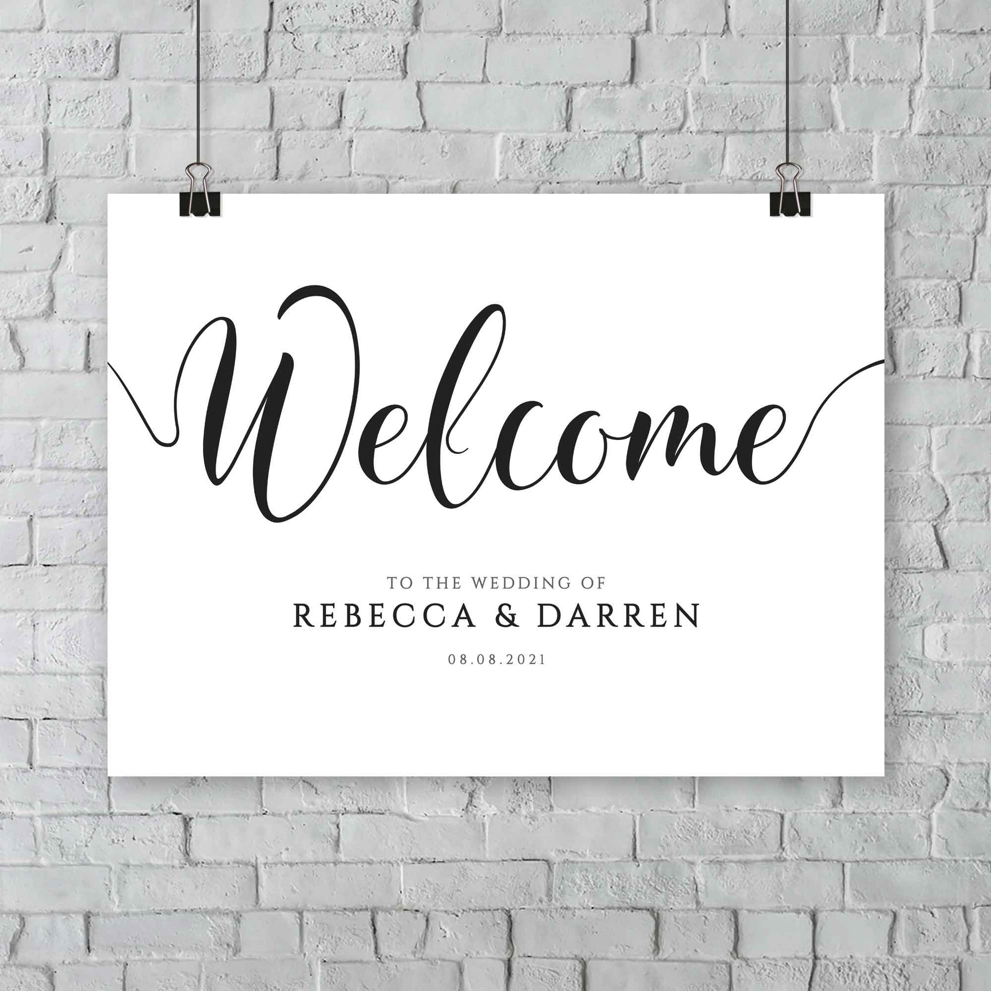 large wedding welcome sign hanging from a wall