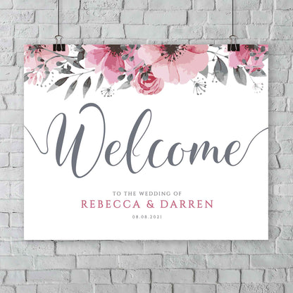 customise welcome sign hanging from a wall at an outside wedding