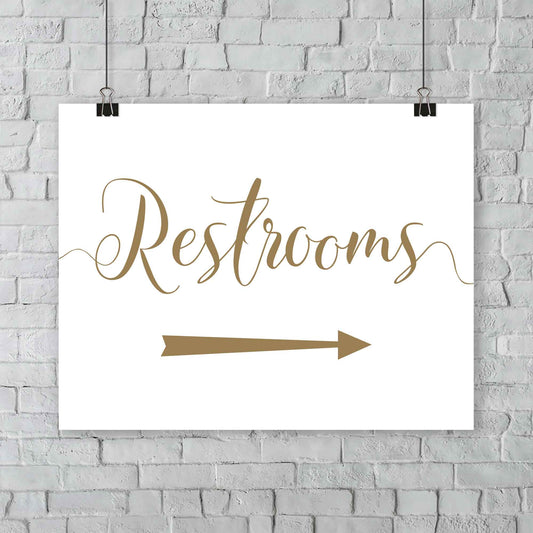 gold restrooms arrow sign at an outside wedding
