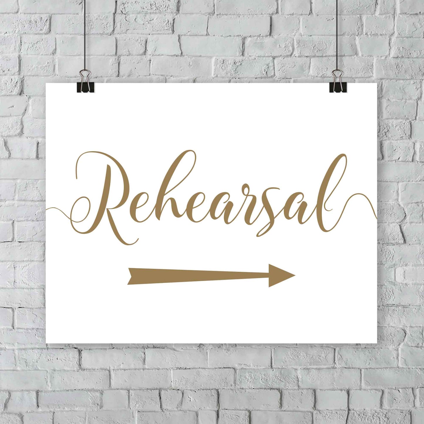 gold rehearsal sign with directional arrows