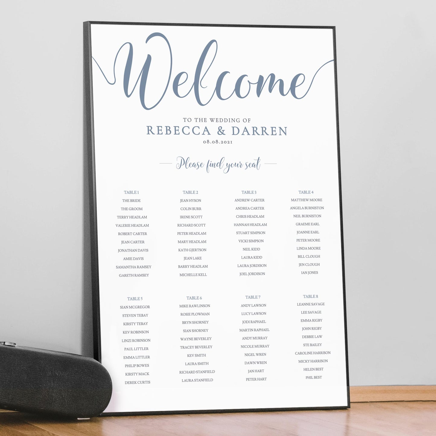 large framed wedding seating chart in dusty blue