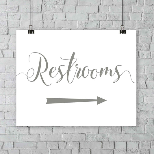 laurel green wedding restrooms arrow signage hanging from a wall