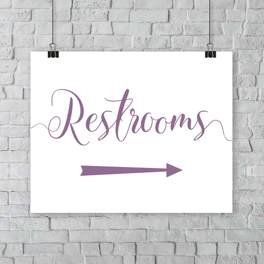 lavender purple wedding restrooms arrow signage hanging from a wall