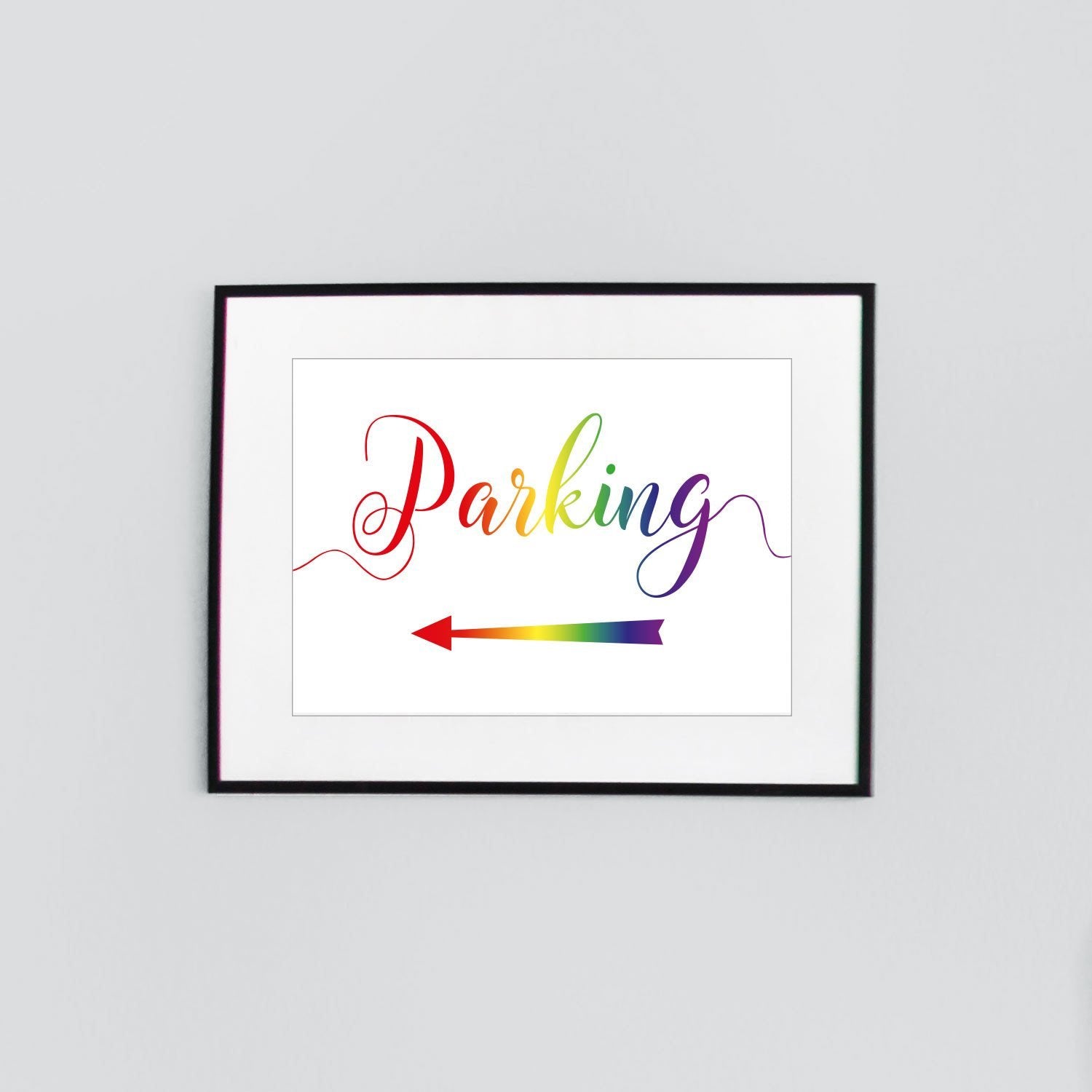 rainbow parking sign with a directional arrow pointing left