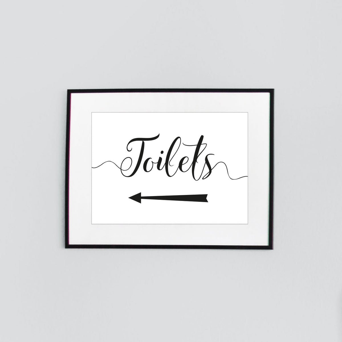 Toilets sign with directional arrow pointing right