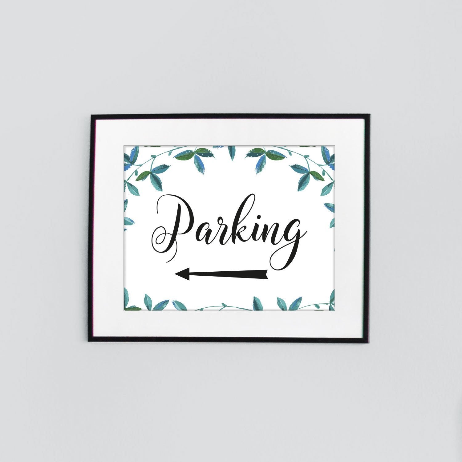 left arrow parking this way sign with green leaves border for weddings