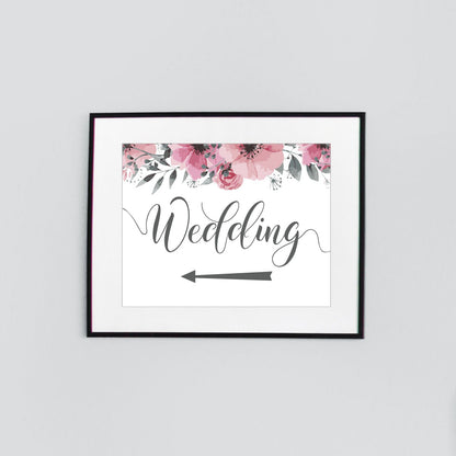 left arrow wedding directions sign in a black picture frame