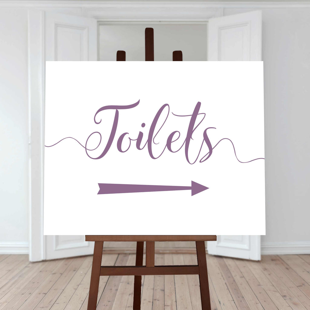 lilac purple wedding toilet directions sign with an arrow pointing right