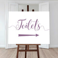 lilac purple wedding toilet directions sign with an arrow pointing right