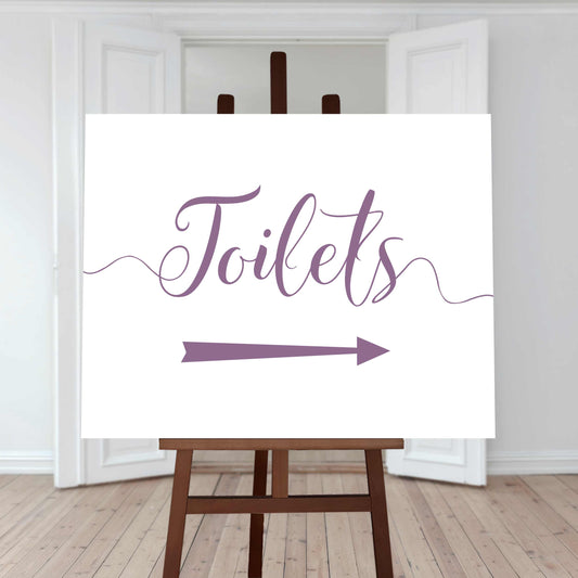 lilac purple wedding toilet directions sign with an arrow pointing right