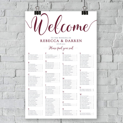 maroon table plan hanging from brick wall