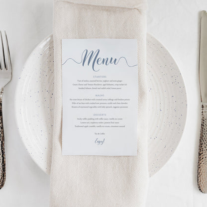 misty blue menu card on a wedding table